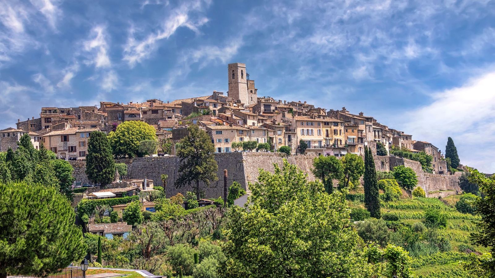 The walled hill village of Saint-Paul-de-Vence with its church tower, ramparts and cypress trees