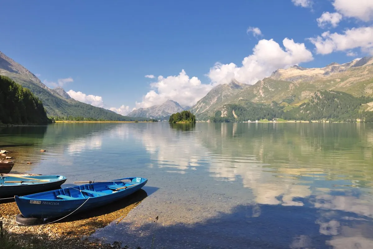 Rowing boats on the shore of Lake Sils near Sils Maria