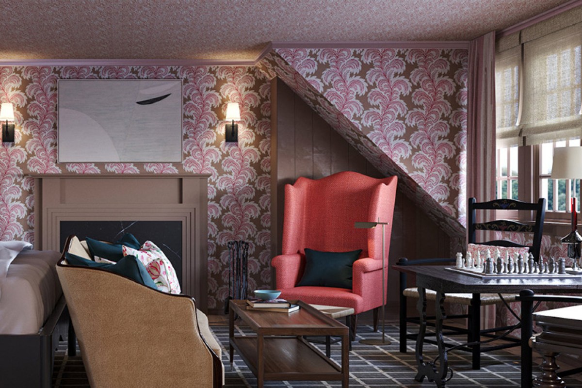 Cozy guest suite at Twin Farms with pink floral wallpaper, armchair, and chess table