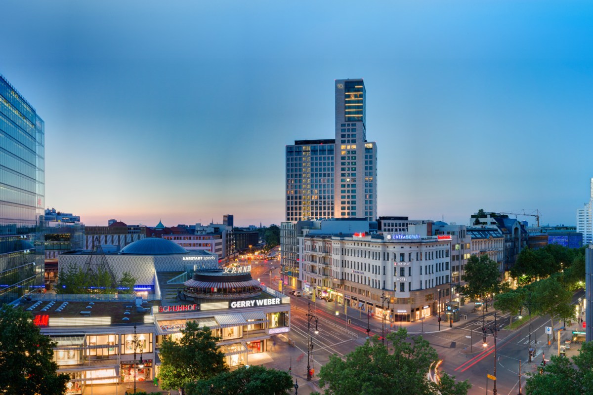 Aerial twilight view of Berlin cityscape with the Waldorf Astoria Berlin tower rising above the Kurfürstendamm shopping district
