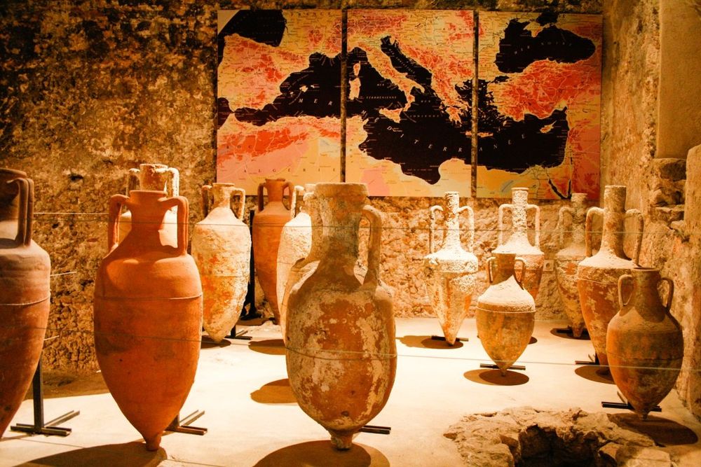 Roman amphorae from shipwrecks displayed in the vaulted cisterns of the Musée du Masque de Fer