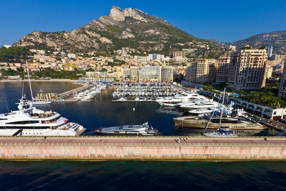 Yachts in the port of Cap-d'Ail below the Tête de Chien, with Monaco's Fontvieille and the Rock beyond