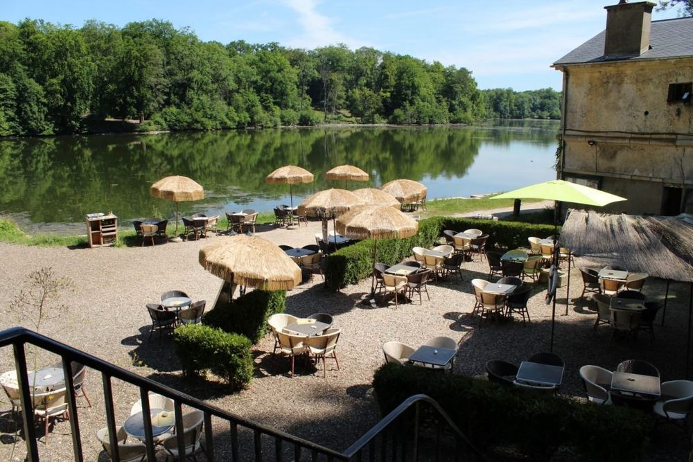 Parasols on the terrace of L'Étang d'Art beside the Étangs de Commelles
