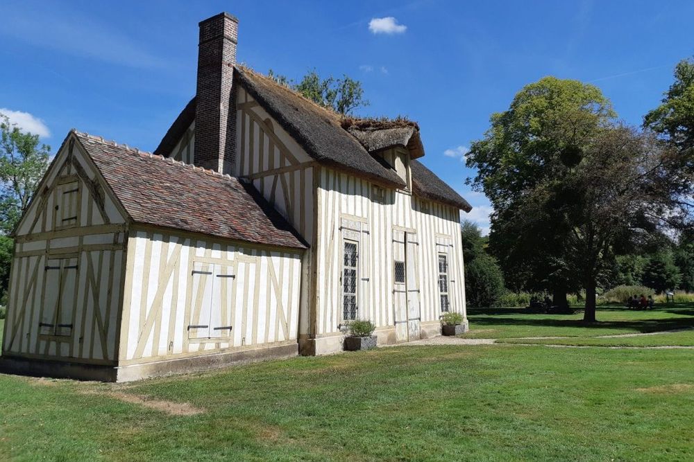 The half-timbered cottage of the Hameau restaurant in the park of the Château de Chantilly