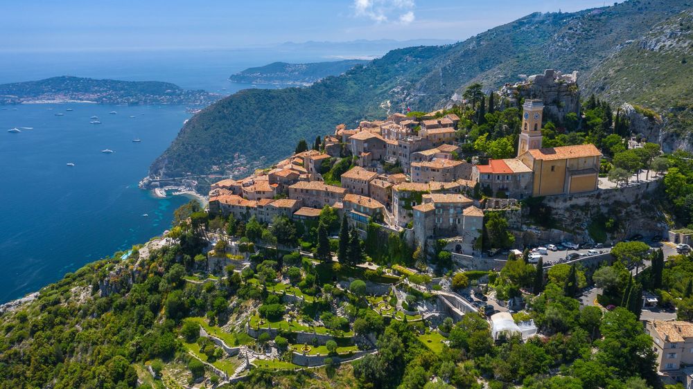 The perched village of Èze on its rocky peak above the coast, with the Mediterranean in the distance