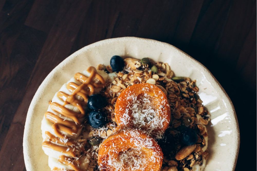 A granola bowl with roasted fruit and berries served at the Bambou Café, Gassin