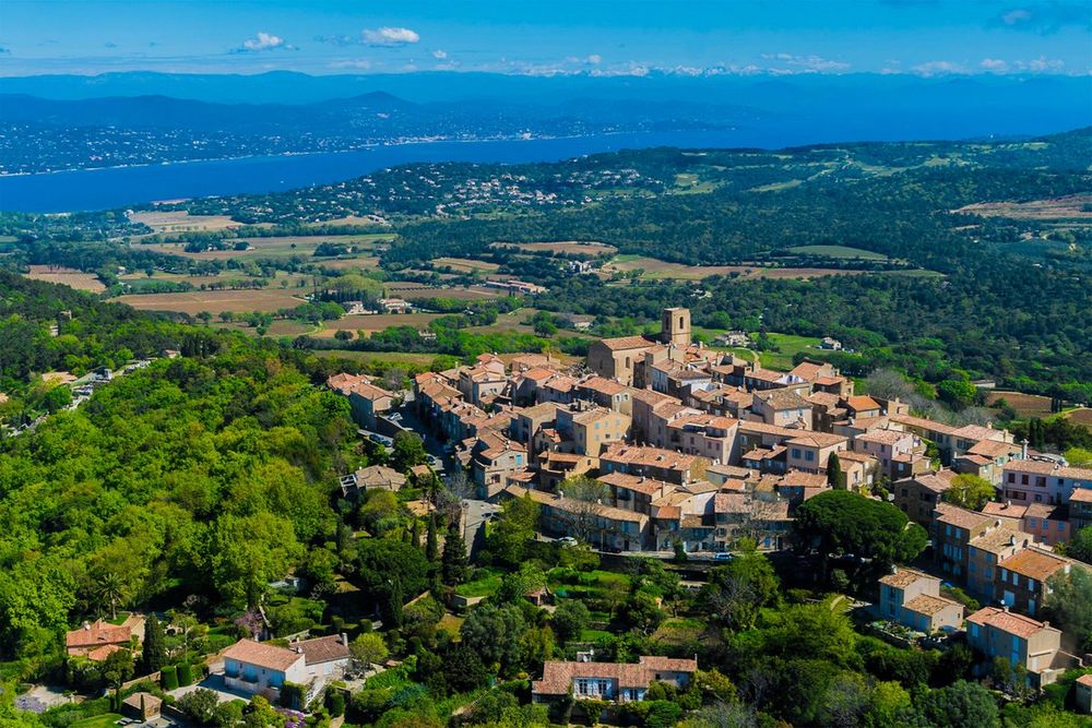 Aerial view of the hilltop village of Gassin with the gulf of Saint-Tropez beyond