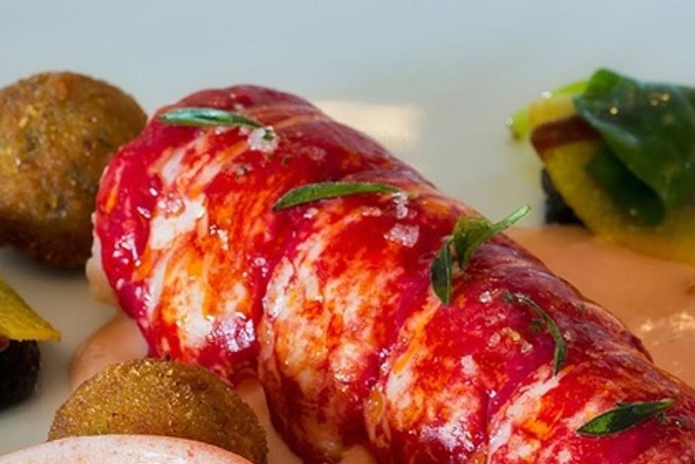 A lobster dish plated at La Place de Mougins