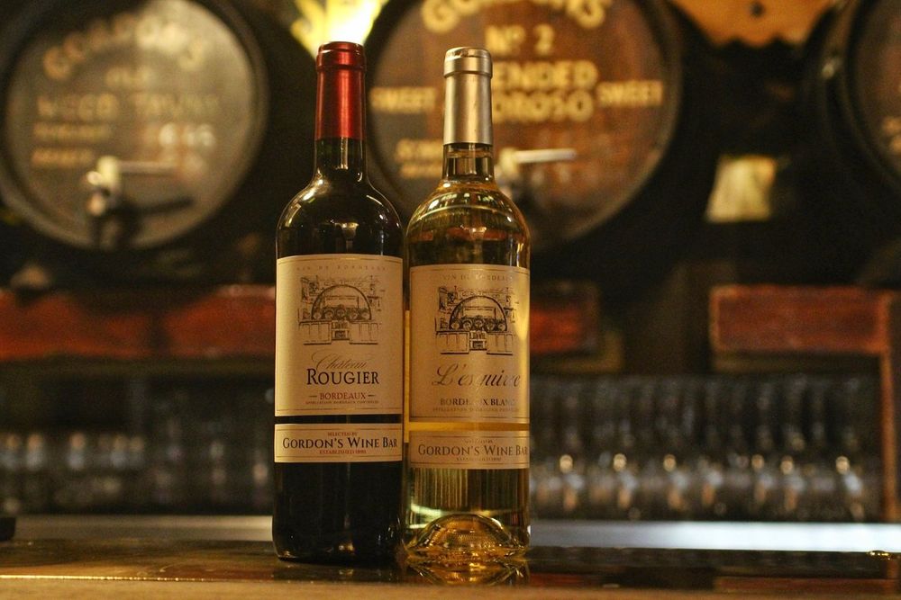Gordon's own-label wines in front of the old sherry and port barrels at Gordon's Wine Bar