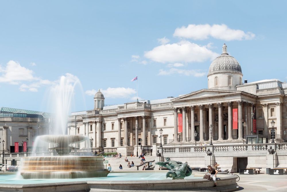 The portico and dome of the National Gallery above the fountains of Trafalgar Square