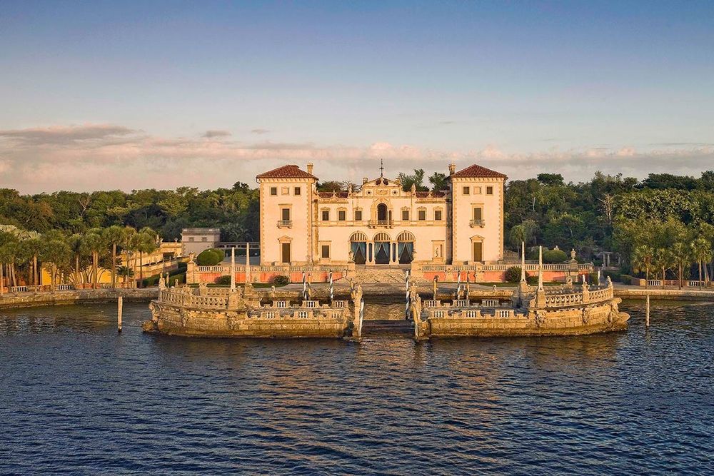 Vizcaya's east facade and the stone barge on Biscayne Bay in evening light