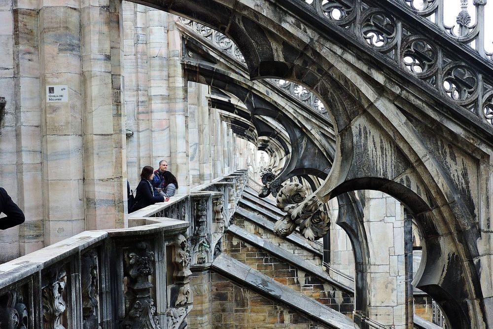 Flying buttresses and carved pinnacles along the terraces of Milan Cathedral