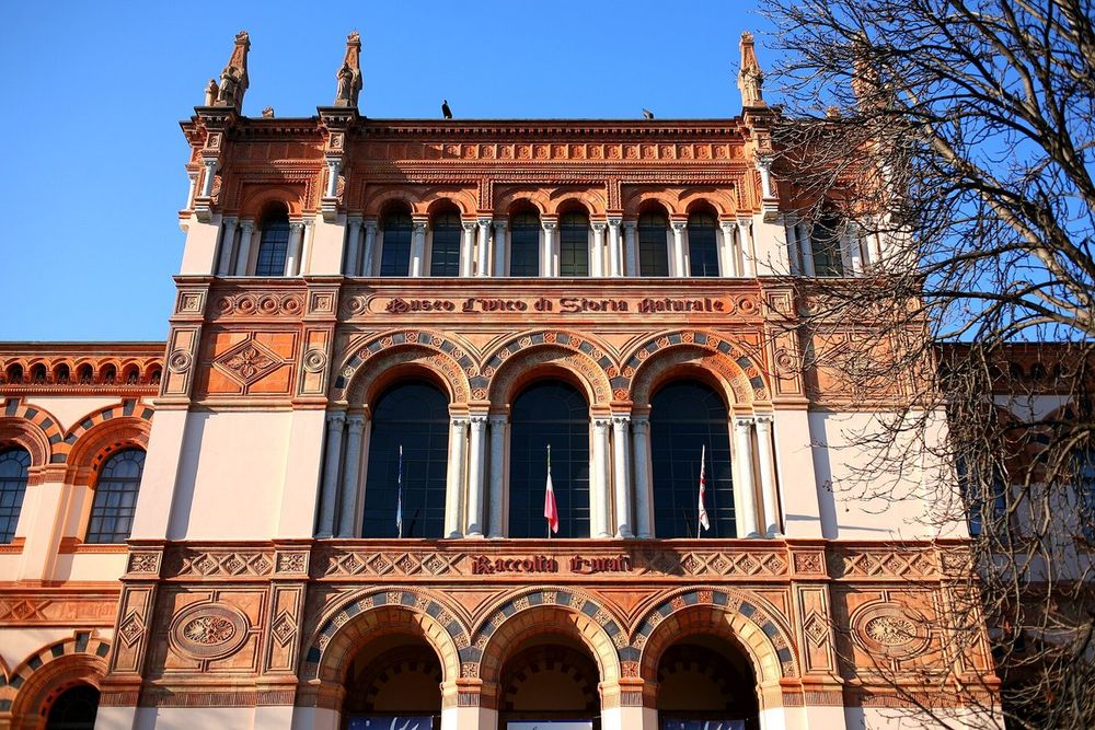 The red-and-cream neo-Romanesque façade of Milan's Natural History Museum