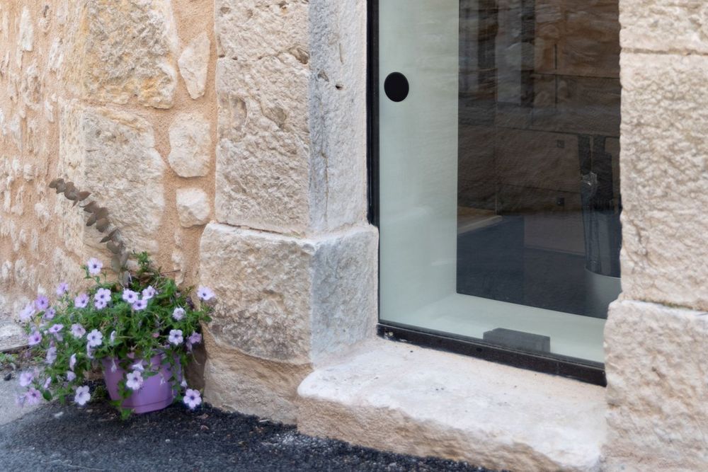 The arched stone doorway of the Centre de la Photographie de Mougins in the old village