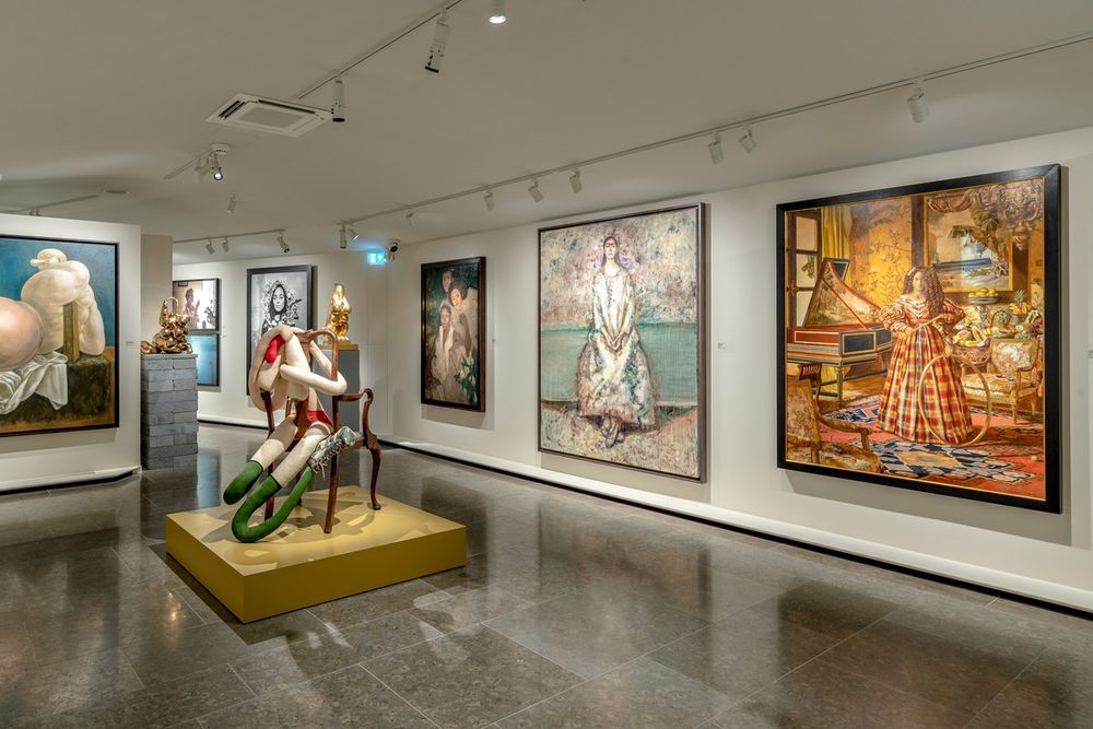 Paintings and sculpture in a white gallery of the FAMM museum in Mougins