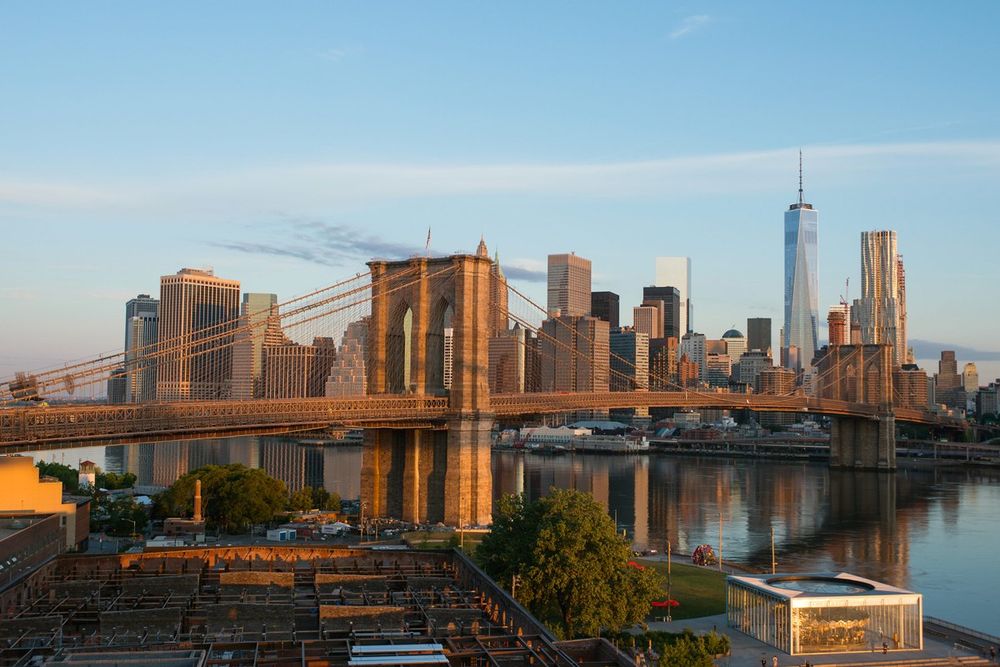 The Brooklyn Bridge and the Lower Manhattan skyline across the East River in late-afternoon light