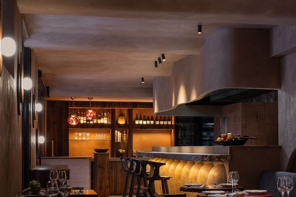 The dining room and open kitchen counter at Colita, between the port of Nice and Castle Hill