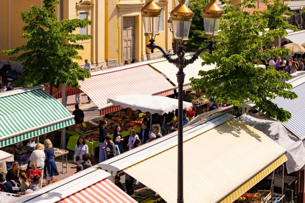 Striped awnings over the market stalls of Cours Saleya, seen from above