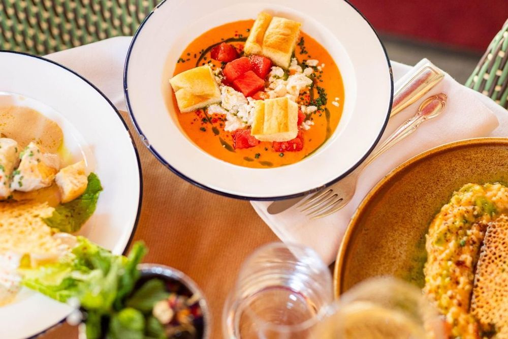 Plates of gazpacho, salad and fish at Fine Gueule in Vieux Nice