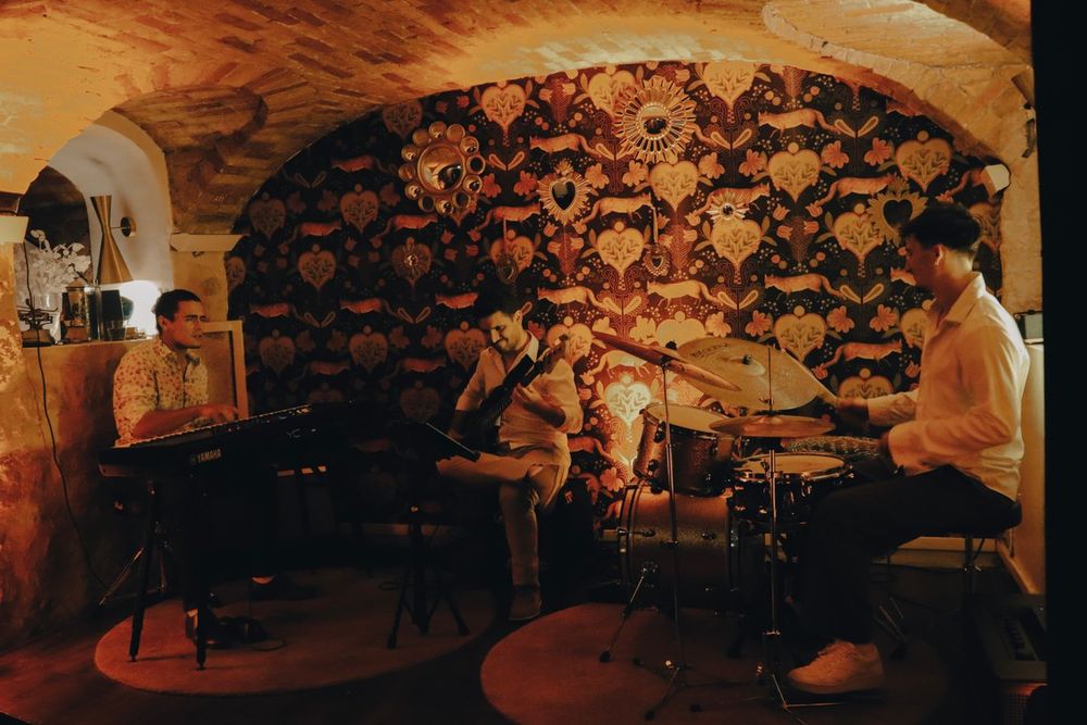 A jazz trio playing under the vaulted ceiling of Zitto Speakeasy on the port of Nice