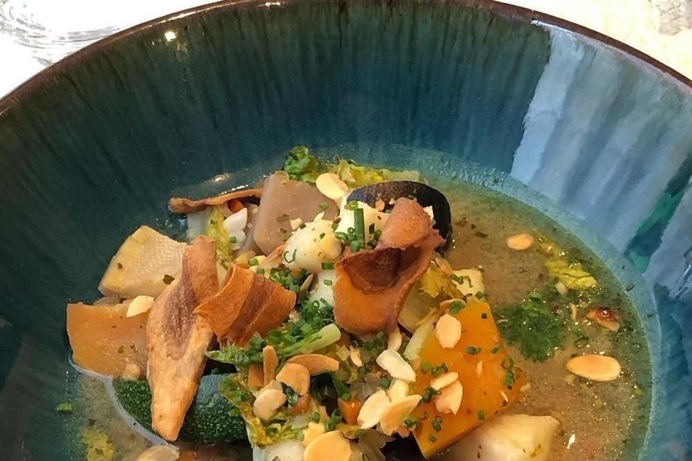 A bowl of mushrooms, squash and broth at Le Wauthier by Cagna, Saint-Germain-en-Laye