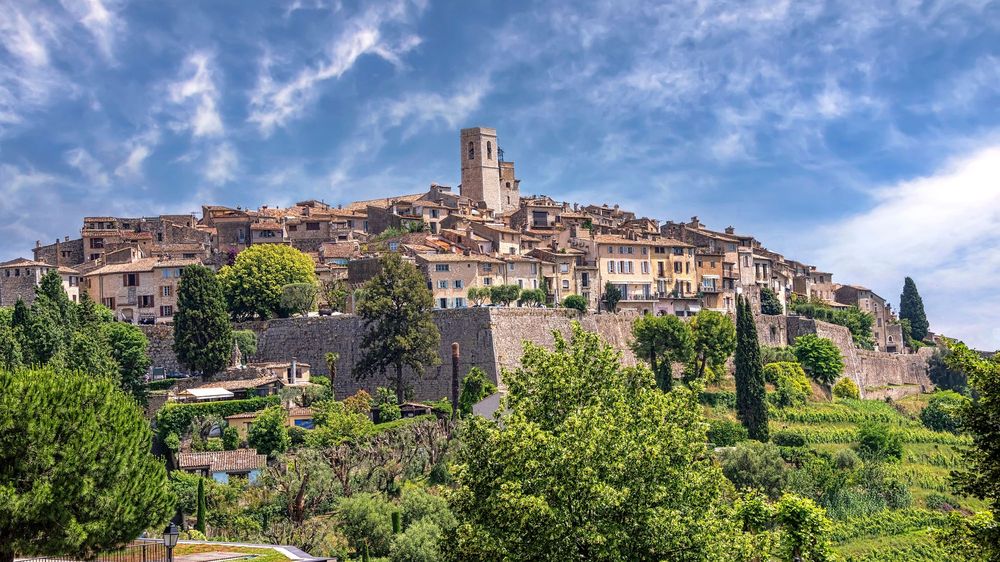 The walled hill village of Saint-Paul-de-Vence with its church tower, ramparts and cypress trees