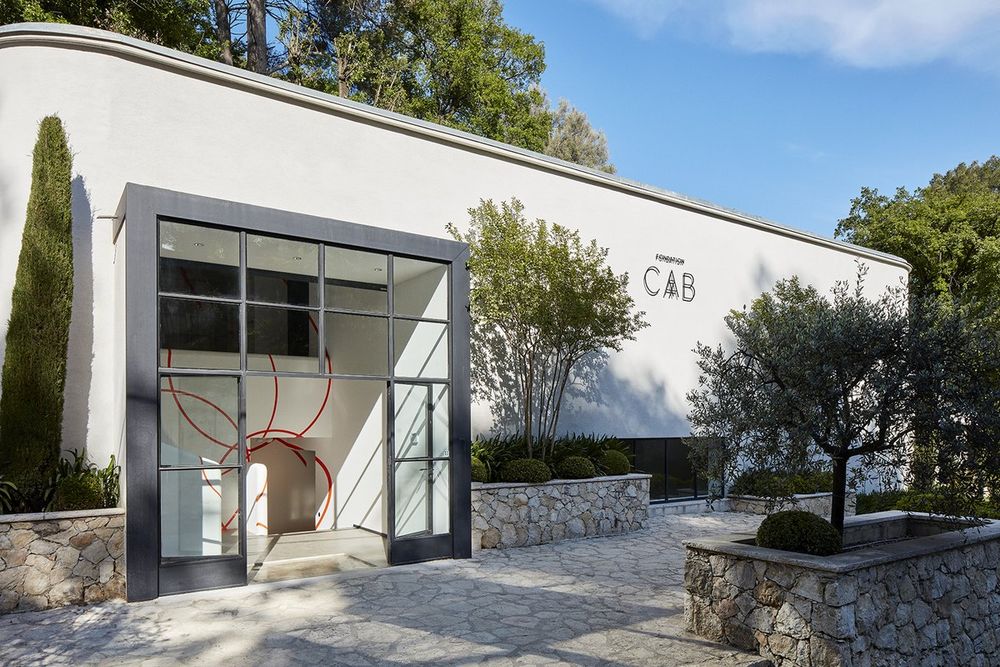 The white 1950s building of the Fondation CAB in Saint-Paul de Vence with its glazed entrance