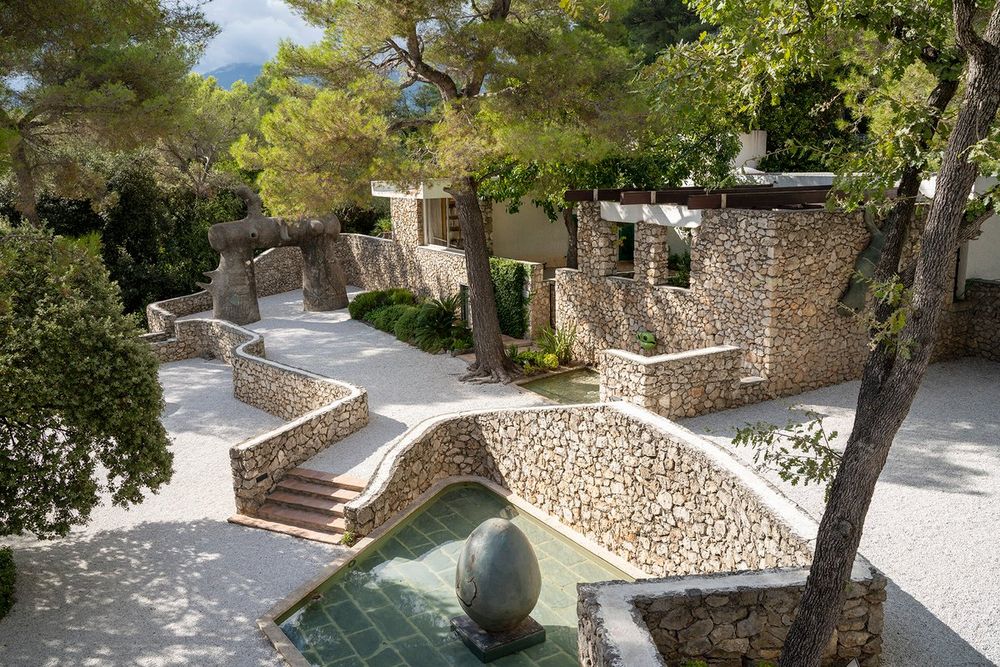 Miró's Labyrinth at the Fondation Maeght: stone walls, a pool and sculptures among the pines