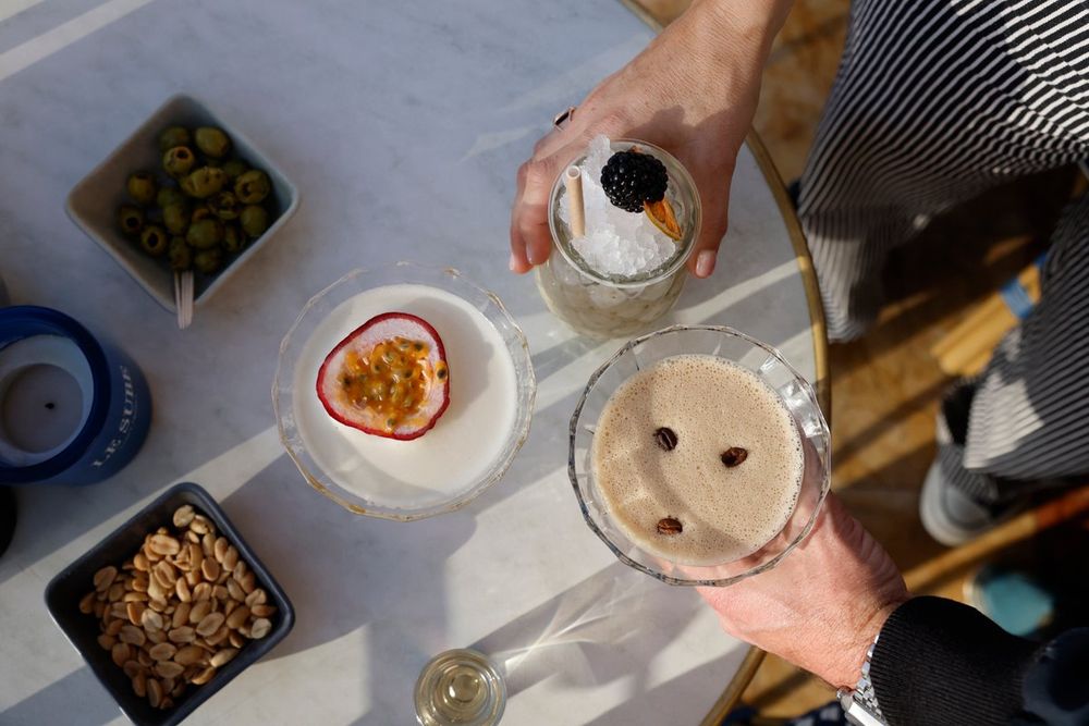 Cocktails and olives served on a table at the Bar du Sube, Saint-Tropez