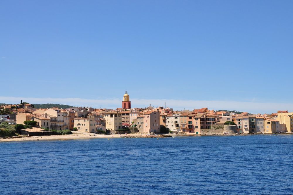 The old town of Saint-Tropez and its bell tower seen from the water, on a Brigantin II sea trip