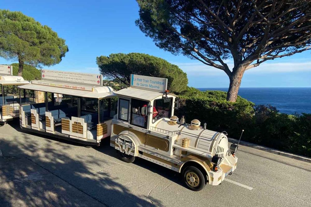 The Petit Train de Sainte-Maxime on a pine-shaded road above the sea