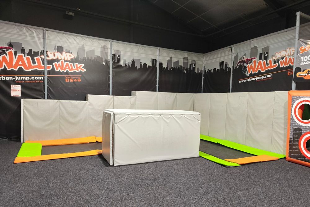The Wall'Walk zone with padded blocks and trampolines at Urban Jump Vallauris