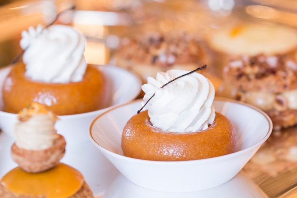Rum babas topped with whipped cream at Ore, Alain Ducasse's café in the Palace of Versailles