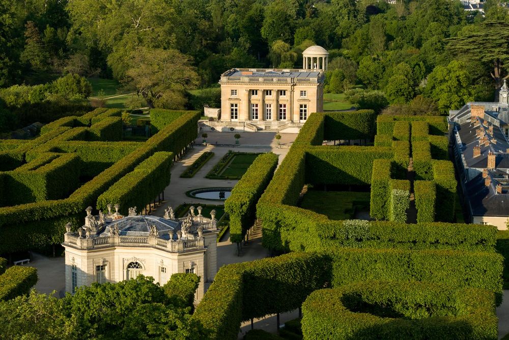 Aerial view of the Petit Trianon and the French Pavilion among clipped hedges on the Estate of Trianon