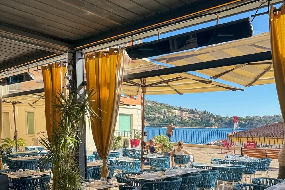The sea-view terrace of Le Cosmo facing the rade, Villefranche-sur-Mer